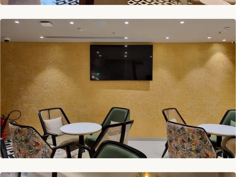 Privée Lounge seating area with mustard feature wall